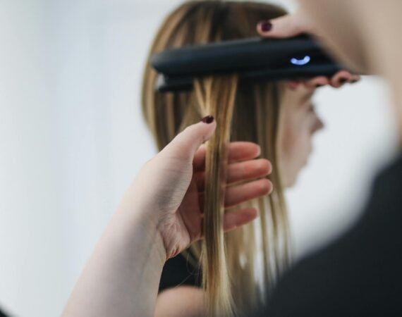 Hairdresser Straightening Clients Hair